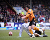 Matt Jarvis rounds Brian Jensen to open the scoring